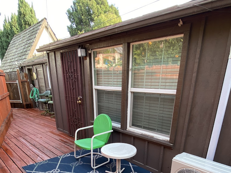 A green chair sitting on top of a blue rug